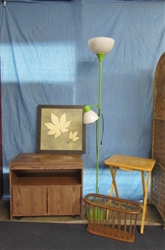 HOUSEHOLD LOT: TV STAND, MAGAZINE HOLDER, FLOOR LAMP, AND LARGE FRAMED PICTURE