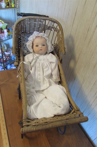 PORCELAIN BABY DOLL IN VINTAGE CARRIAGE