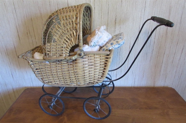 PORCELAIN BABY DOLL IN VINTAGE CARRIAGE