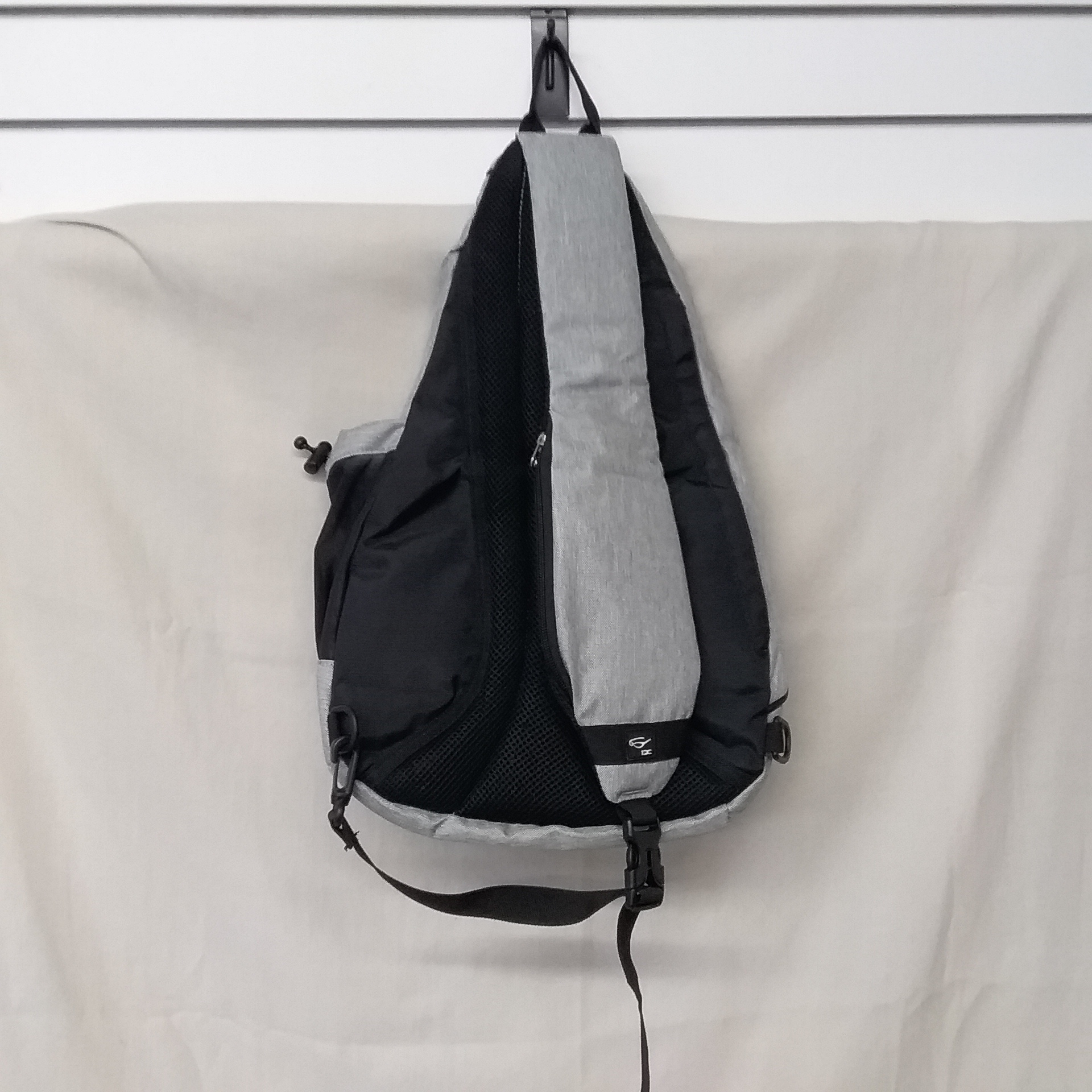Lot Detail - DC INOXTO SLING BAG