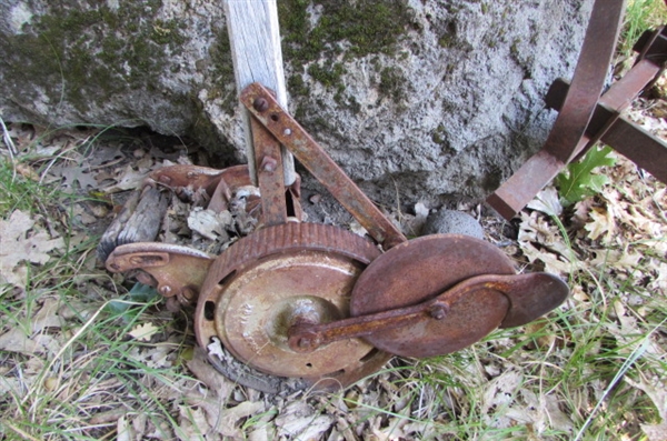 ANTIQUE EDGER YARD ART