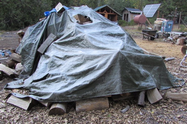 PILE OF SPLIT FIREWOOD