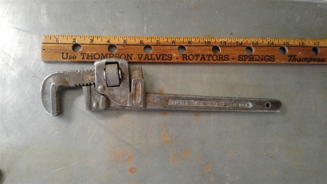 PIPE WRENCHES AND CAST IRON SIGN