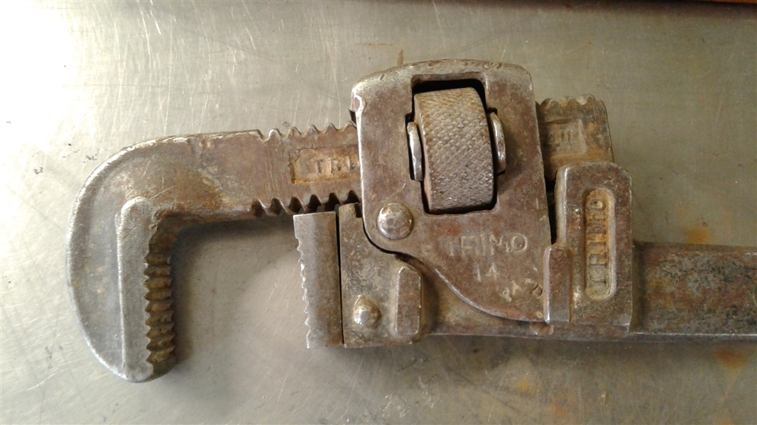 PIPE WRENCHES AND CAST IRON SIGN