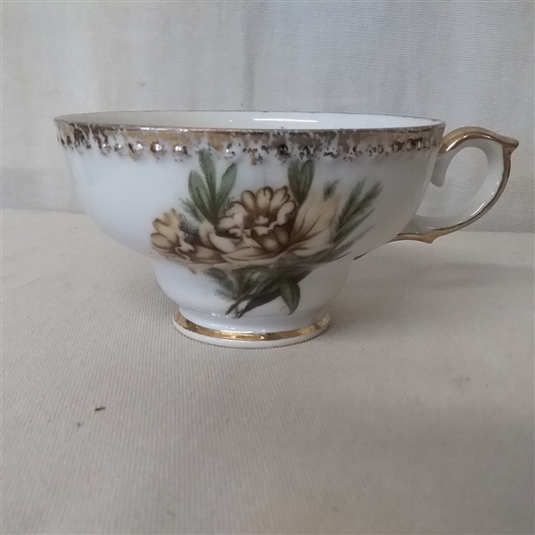 PORCELAIN AND CHINA PIECES AND 11 PLASTIC CUP AND SAUCER HOLDERS