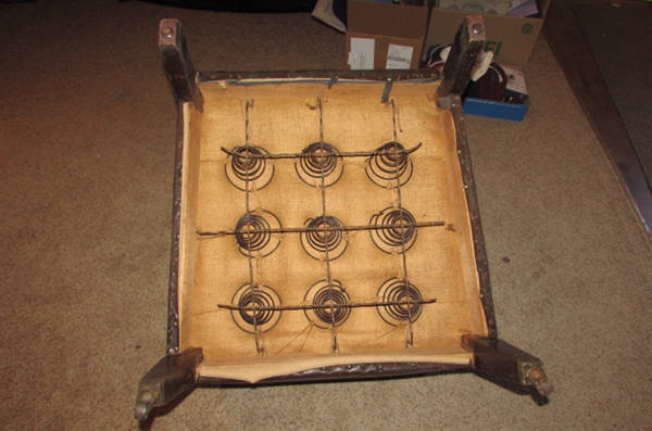 ANTIQUE NAUGAHYDE CHAIR WITH FRONT WHEELS