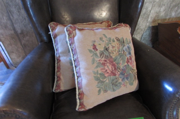 ANTIQUE NAUGAHYDE CHAIR WITH FRONT WHEELS