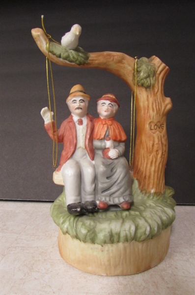 OLD COUPLE FIGURINES AND A MUSICAL FIGURINE