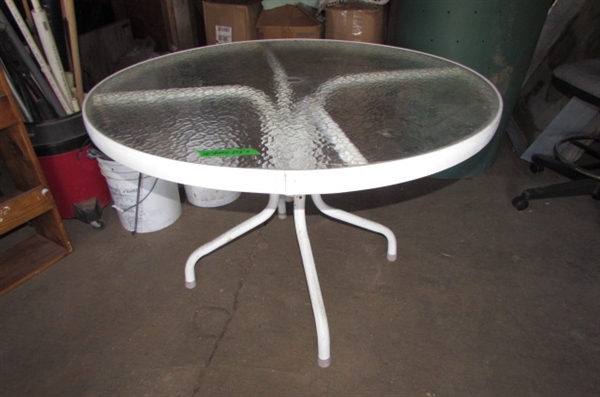 WHITE METAL PATIO TABLE WITH GLASS TOP *LOCATED AT THE PAYNE LANE ESTATE*