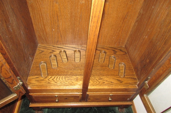 BEAUTIFUL OAK GUN CABINET WITH LEADED GLASS DOORS *LOCATED AT MONTAGUE ESTATE*