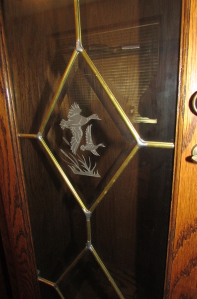 BEAUTIFUL OAK GUN CABINET WITH LEADED GLASS DOORS *LOCATED AT MONTAGUE ESTATE*