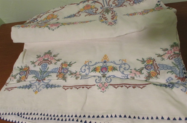 2 HAND STITCHED TABLECLOTHS AND 1 ROUND MACHINE STITCHED