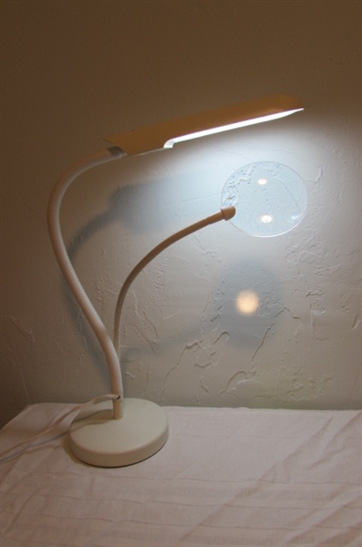 ADJUSTABLE TABLE LAMP AND MAGNIFIER.