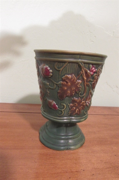 GREEN VASE WITH LIGHT COLORED MULTICOLORED VASE