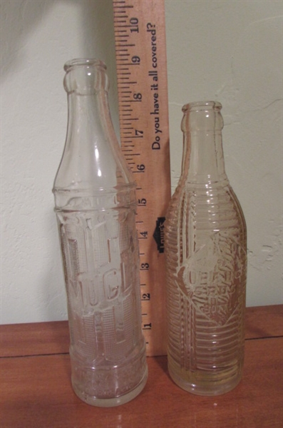 LARGER OLD BOTTLES INCLUDING A SHASTA WATER BOTTLE WITH PUMP