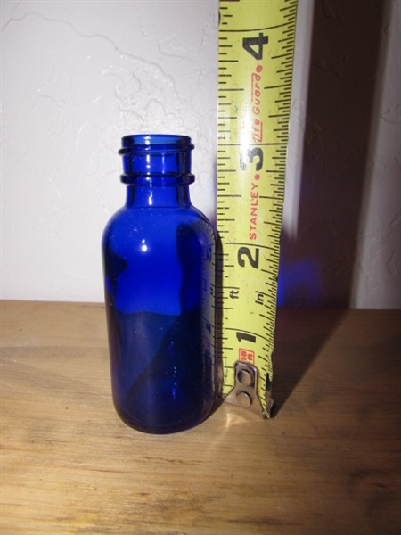 CASE OF BLUE GLASS BOTTLES WITH BULB SYRINGE TOPS