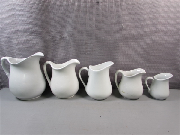 Various Water Pitchers and Creamers