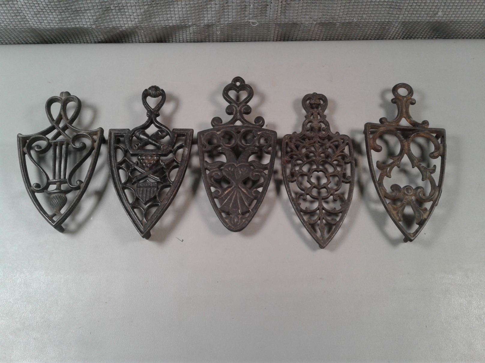 Lot Detail - 5 Vintage Cast Iron Trivets