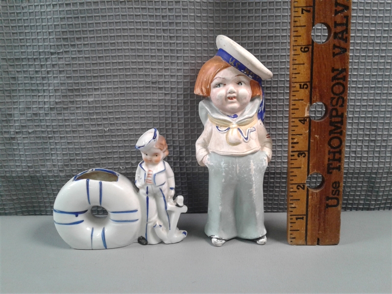 Two Sailor Figures, A Mug, 3 Plates, and Nutmeg Holder  
