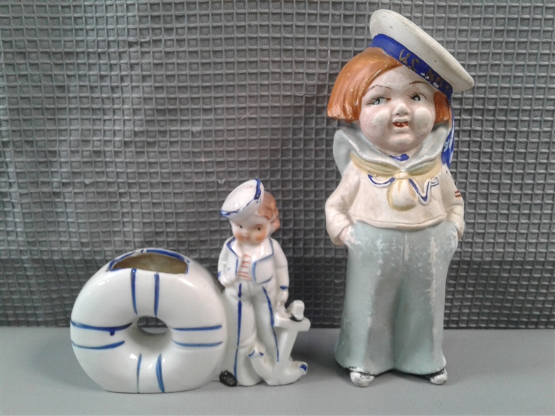 Two Sailor Figures, A Mug, 3 Plates, and Nutmeg Holder  