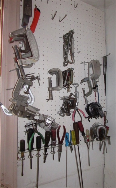 CONTENTS OF PEG WALL - C-CLAMPS AND SCREWDRIVERS