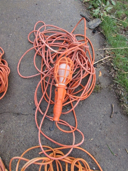7 EXTENSION CORDS AND A DROP LIGHT