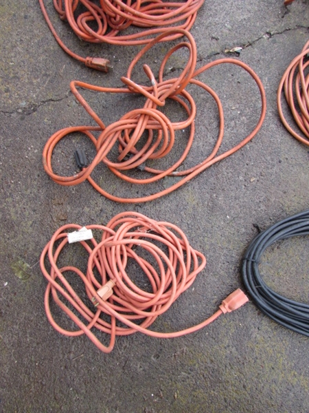 7 EXTENSION CORDS AND A DROP LIGHT