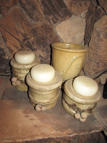 3 POTTERY BASES WITH CANDLES AND A GLAZED TERRACOTTA URN/PLANT VESSEL