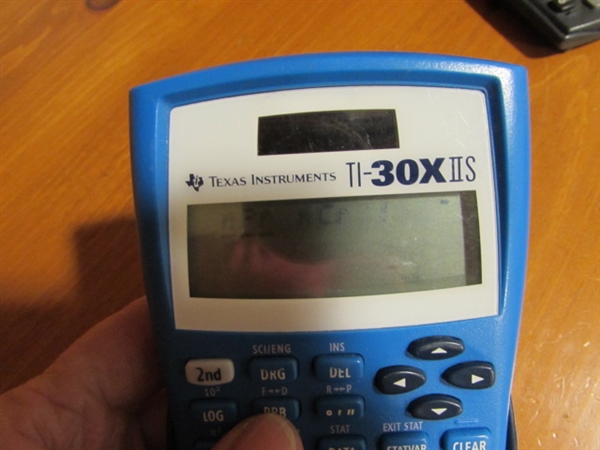 FOUR TEXAS INSTRUMENTS SCIENCE AND MATH CALCULATORS