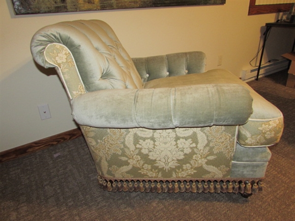 BEAUTIFULLY CRAFTED AND UPHOLSTERED OVERSIZED VELOUR, BUTTON-TUFTED, ROLLED ARM AND TASSEL SKIRTED LIBRARY ARMCHAIR (MATCHES LOT 216)