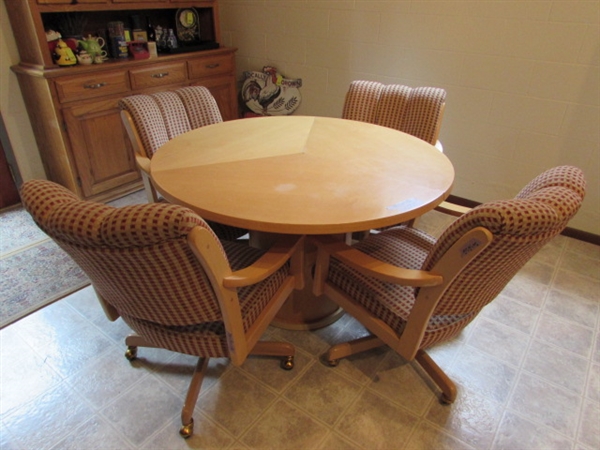 SKOVBY 32 OAK DINING TABLE AND FOUR ROLLING SWIVEL OAK CHAIRS