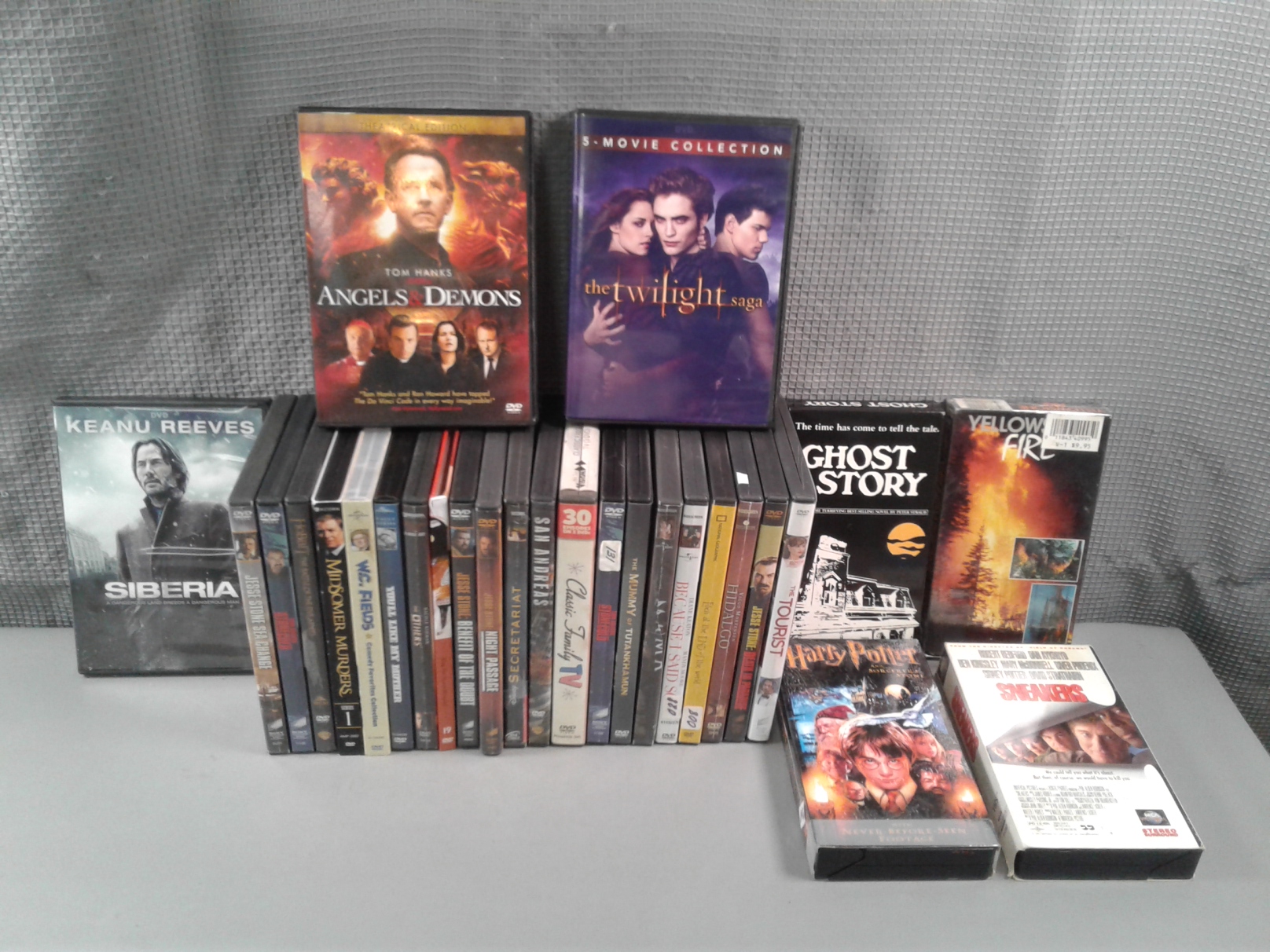 Lot Detail - Collection of 24 DVDs and 4 VHS Tapes