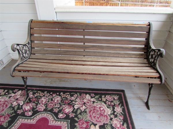 Outdoor Cast Iron and Wood Bench. In good condition.