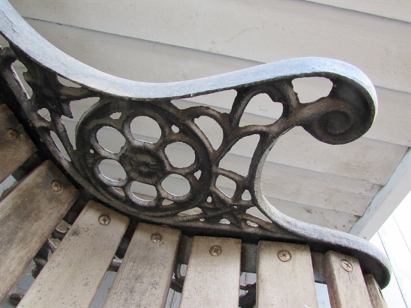 Outdoor Cast Iron and Wood Bench. In good condition.