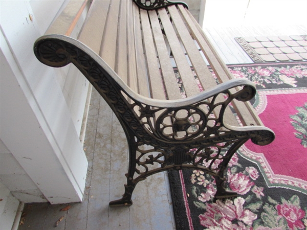 Outdoor Cast Iron and Wood Bench. In good condition.