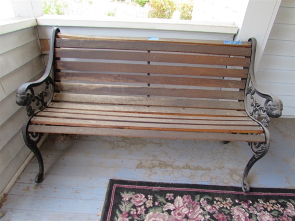 Outdoor Cast Iron and Wood Bench. In good condition.