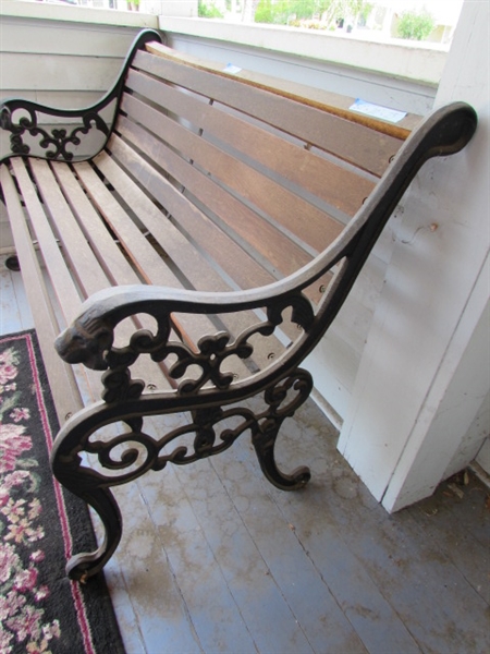 Outdoor Cast Iron and Wood Bench. In good condition.