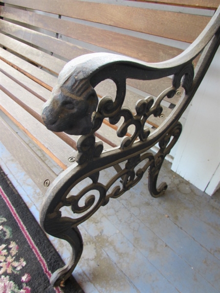 Outdoor Cast Iron and Wood Bench. In good condition.