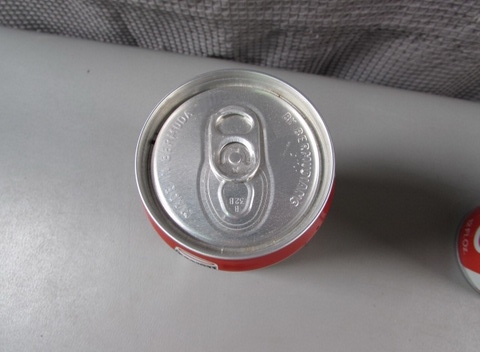 Empty Coca-Cola Cans and Koka-Kora Russian Banks