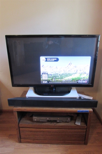 42 TV, OAK STAND, SOUND BAR AND DVD/VHS PLAYER