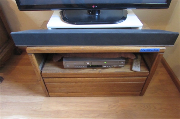 42 TV, OAK STAND, SOUND BAR AND DVD/VHS PLAYER