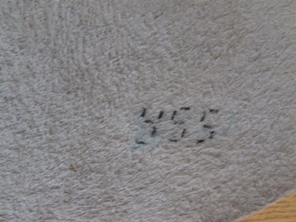 LARGE WHITE ANIMAL HIDE AND LITTLE COW FOOTSTOOL.