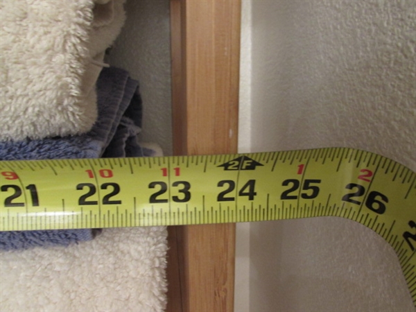 OVER THE TOILET WOODEN SHELF UNIT AND TOWELS
