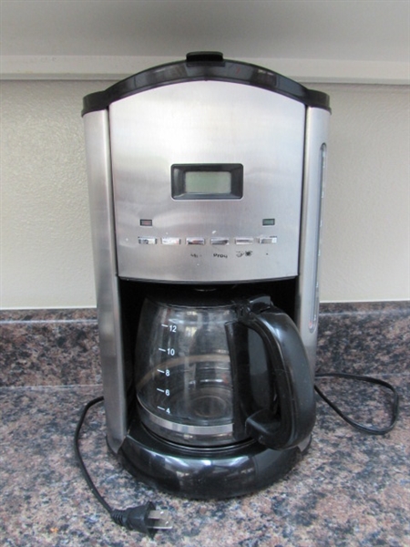TEA KETTLE, COFFEE MAKER, COFFEE GRINDER AND LARGE ASSORTMENT OF CUPS.