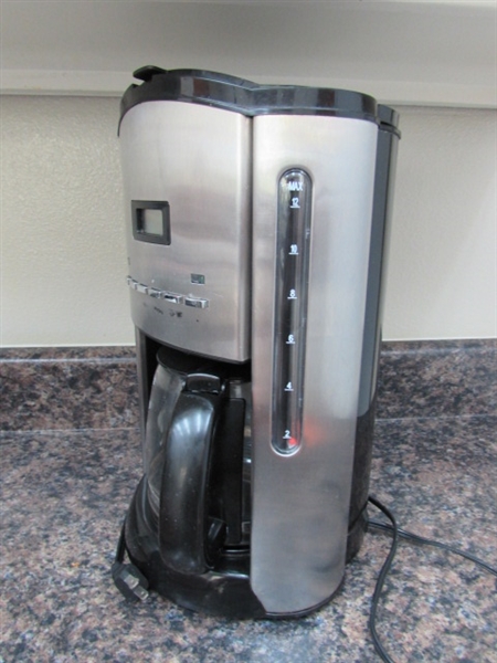 TEA KETTLE, COFFEE MAKER, COFFEE GRINDER AND LARGE ASSORTMENT OF CUPS.