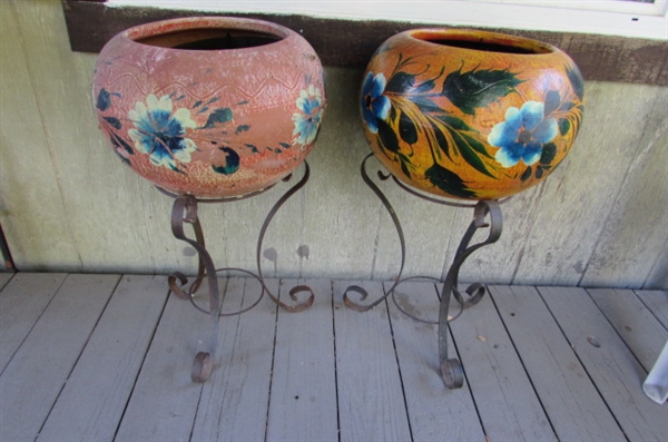 PAIR OF WROUGHT IRON PLANT STANDS WITH CLAY PLANTERS