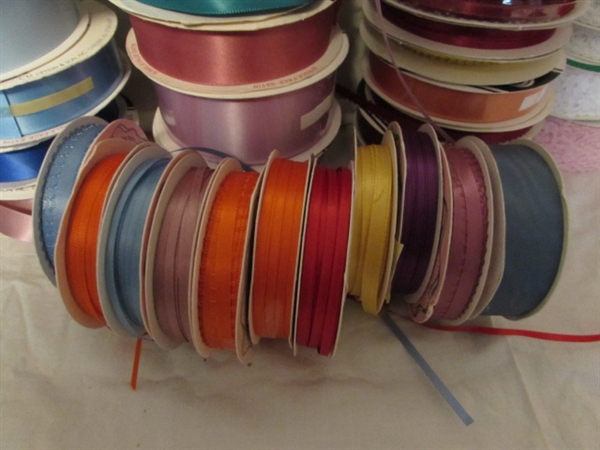 2 LARGE TINS WITH ROLLS OF RIBBON