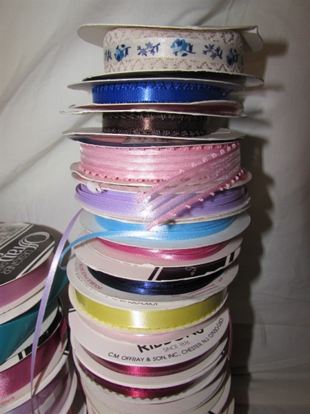2 LARGE TINS WITH ROLLS OF RIBBON