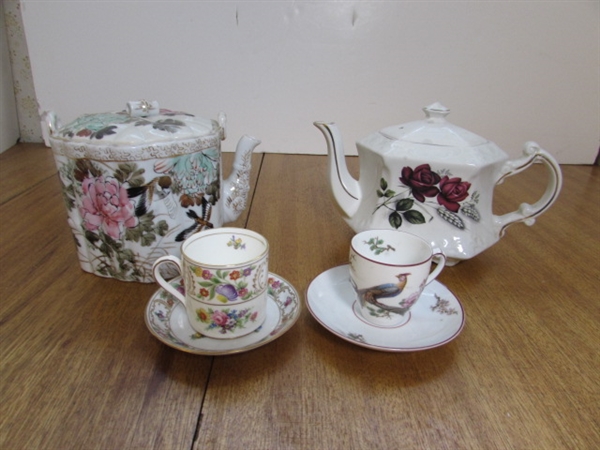 TEA POTS, CUPS AND SAUCERS