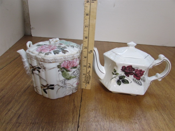 TEA POTS, CUPS AND SAUCERS